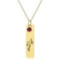 Detailed view of a gold rectangular pendant featuring a red gemstone and floral engraving - January - Snowdrop