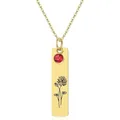 Macro detail of gold floral engraved pendant with a red gemstone on a simple cable chain - July - Water Lily