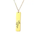 Macro view of gold rectangular stainless steel pendant with black flower engraving - Snowdrop Style (7)