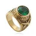 Detail of vintage gold ring featuring a large green gem and United States embossing - US 8 / Gold Green Stone