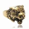Detailed close-up of a golden roaring tiger head ring with intricate metal engraving - US 7 / Antique Gold