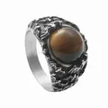 Detail view of a vintage titanium steel ring featuring a round brown tiger eye stone - US 7 / Vintage Silver With Brown Stone