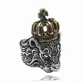 Close-up of vintage lion head ring with gold crown and cross details on silver band - US 7 / Gold & Silver