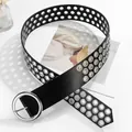 Detail of a black punk waist belt with triple rows of silver metal eyelets and a round buckle - Silver