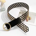 Detail of black punk leather belt with triple-row gold grommets and round buckle - Gold