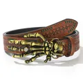Detailed view of skull hand belt buckle with rhinestone on vintage embossed leather - Ancient Gold Skull Hand (Skull Claw)