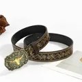 Detail of vintage brown leather belt with golden floral patterns and bull head buckle - Golden Bull Head / 100