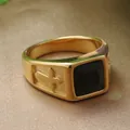 Close-up of gold stainless steel ring featuring a black square stone and cross relief - Gold Black Stone