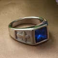 Macro shot of vintage steel ring featuring a blue square stone and cross relief detail - US 7 / Steel Color Blue Stone