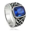 Detailed view of vintage steel ring with blue stone and Celtic knot patterns - US 7 / Silver With Blue Stone