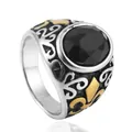 Vintage stainless steel ring with black faceted gemstone and gold fleur-de-lis patterns - US 7 / Two Tone With Black Stone