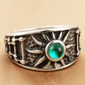 Vintage stainless steel sunburst ring with green stone center on brown fabric - US 7 / Steel Green Stone