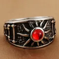 Macro detail of retro punk stainless steel ring with red stone and sunray texture - US 7 / Steel Red Stone