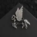 Close-up of silver Pegasus brooch with sparkling rhinestones on black leather background - Silver Hollow Pegasus (XZ09-022 Silver)