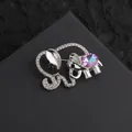 Exquisite silver elephant brooch with crystals and shimmering opal-like gemstone detail - Silver