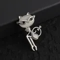Detailed view of silver cat brooch with cat's eye stone and green crystal accents - Silver Cat