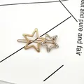 Goldene geometrische Doppelstern-Haarklammer mit glitzernden Strasssteinen und Matt-Finish - Gold