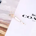 Fermaglio per capelli creativo a forma di forbice in metallo oro rosa su cartoncino - Oro