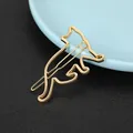 Macro detail of golden cat silhouette hair clip with minimalist metal finish - Cat Silhouette Style