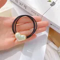 Elastisches Herz-Haargummi mit schillernder Perle und Goldrand für Damen - Herzanhänger Dreistrang-Haarseil