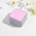 Detail view of a velvet jewelry gift box in grey and pink with daisy props - 7.5cm Box / Pink