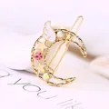 Charmanter goldener Mond-Haarclip mit weißem Flügel und funkelnden Strasssteinen - Mond Rosa Strass