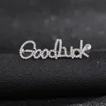 Close-up of Goodluck letter brooch with silver plating and pavé white rhinestones - Silver Goodluck Style