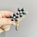 Eleganter goldener Blumenanstecker mit schwarzen Emaille-Blüten und Strasssteinen - Schwarz (XZ83)