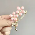 Eleganter goldfarbener Blumen-Brosche mit rosa Emaille-Blüten und funkelnden Strasssteinen - Rosa (XZ83)