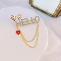 Golden HELLO brooch with crystal rhinestones, a red heart pendant and elegant double chains - HELLO Letter Heart Style