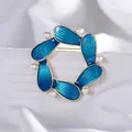 Elegant gold-tone brooch with blue enamel petals and white pearls on white silk - Blue Pearl Petal Style
