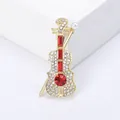 Spilla a forma di violino dorata con pietre rosse e perla bianca raffinata - Stile Violino Rosso / Rosso