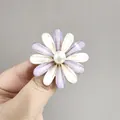 Elegant sunflower brooch with purple and white petals and a pearl center on hand - Purple (XZ118)