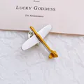 Minimalist airplane brooch in silver and gold metal finish with butterfly clasp - Airplane Style