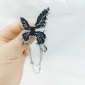 Silver butterfly brooch with black enamel wings and elegant hanging chain tassels - Dripping Oil Butterfly Tassel