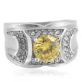 Primer plano de anillo vintage de acero titanio con gran gema amarilla y diamantes blancos - Piedra Amarilla Acero