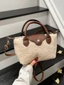 Chic cream fleece dumpling bag with brown leather handles and adjustable shoulder strap - Khaki