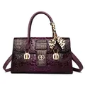 Elegant purple crocodile embossed handbag with gold accents and leopard scarf detail - Purple