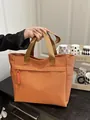 Helle orangefarbene gewebte Tragetasche mit großer Kapazität und robusten Nylon-Trägern - Orange