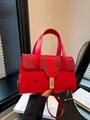 Elegant red handbag with sequined flap and gold buckle, versatile crossbody strap - Red