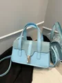 Light blue faux leather handbag with shimmering rhinestones and golden turn-lock - Blue