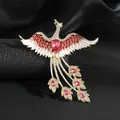 Detalle macro de broche de fénix con cristales rojos y esmalte blanco en seda negra - Fénix Rojo Estilo 1