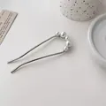 Elegant silver U-shaped hair pin with five white pearls on a minimalist background - Silver Pearl U-Shaped Hair Stick