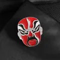 Chinese Opera mask brooch in red enamel with intricate traditional metal craftsmanship - Peking Opera Mask Style