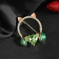 Cat ear headphone brooch with green heart crystal and rhinestones on black fabric - Green Heart Style / Green Headset