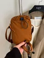 Waterproof nylon crossbody bag in deep brown with drawstring closure for outdoor leisure - Orange