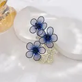 Detail of elegant blue mesh flower brooch with sparkling rhinestone butterfly pin - Blue