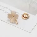 Macro shot of clover lapel pin with cat-eye heart petals and a gold metal base - Four-Petal Flower