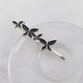 Elegant gold-tone bobby pin featuring three black enamel butterflies and white pearls - Black Butterfly Style (Left Side Butterfly)