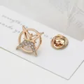Detailed macro view of golden star-shaped lapel pin with clear crystals and butterfly clutch - Gold Hexagram